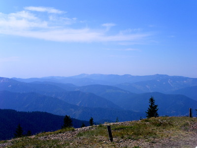 [The many neighboring mountains are shades of blue-grey indicating their distance from Kellogg Mountain. They all seem lower in height than Kellogg Mountain.]